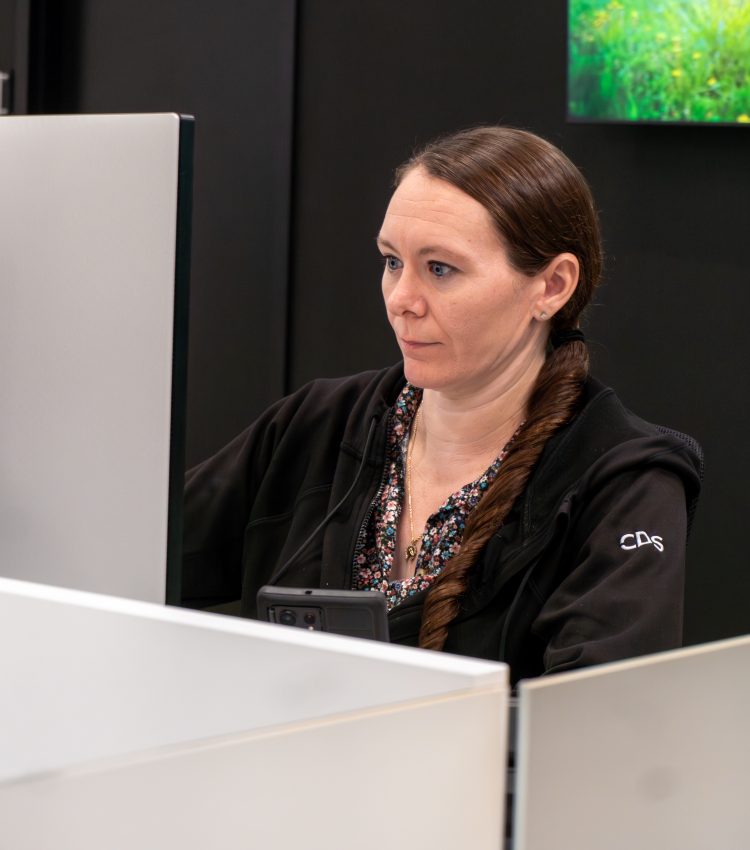 CDS employee working at desk