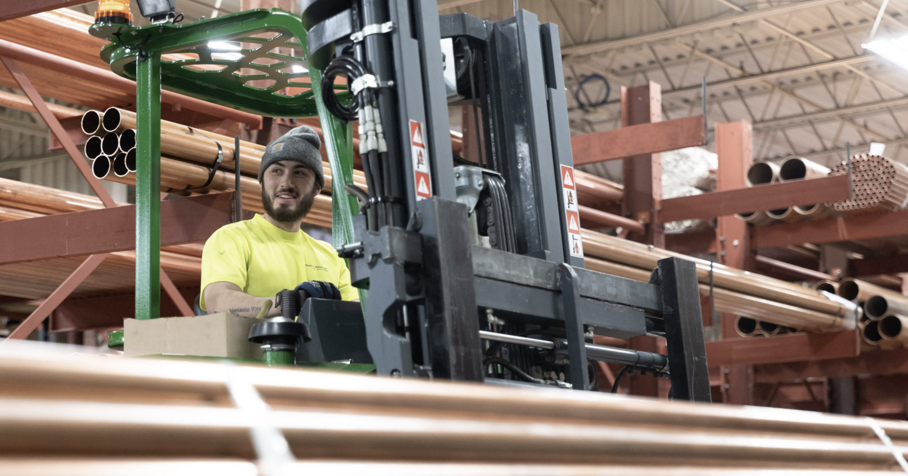 CDS team member operating machinery in the warehouse