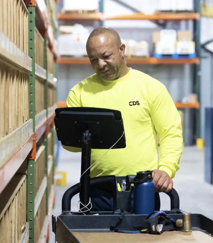 CDS employee working in the warehouse